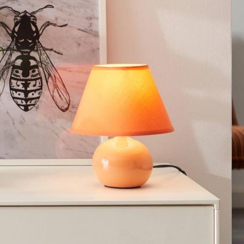 Brilliant Primo bordslampa, orange, Ø 19 cm, textil/keramik