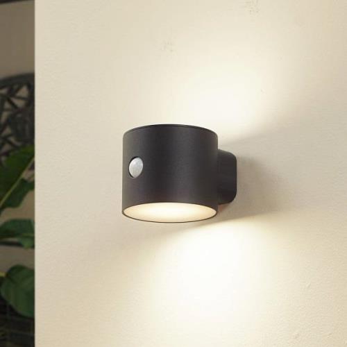 Lindby LED-vägglampa Amren, svart, ABS, sensor